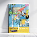A framed vintage-style travel poster leaning against a white wall on a light floor. The poster depicts a Parisian cafe scene with the Eiffel Tower, Arc de Triomphe, seated figures, and large text reading 'Le plus bel pays du monde France' with 'SABENA' at the bottom.