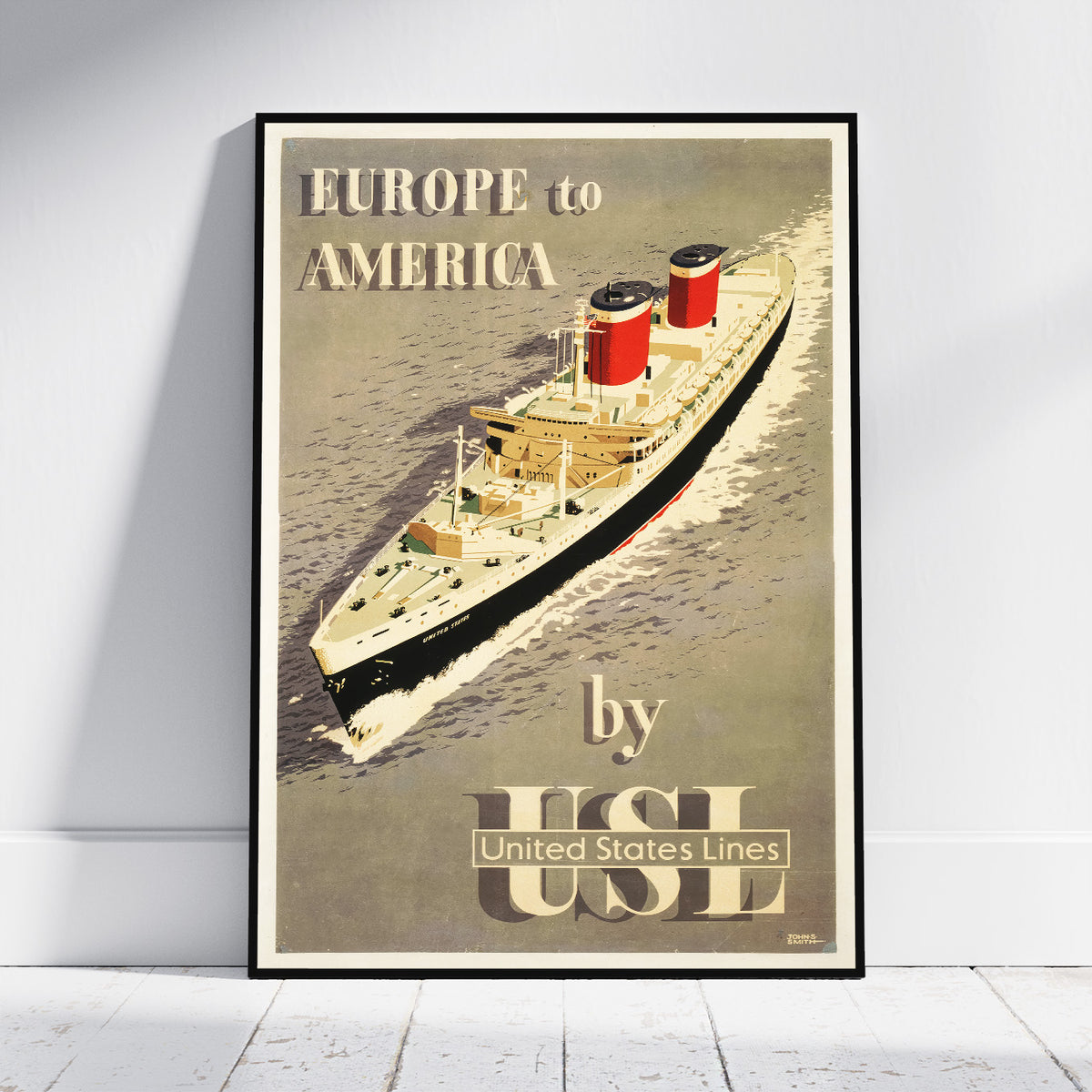 A framed vintage travel poster leaning against a white wall on a light floor. The poster shows a large ocean liner sailing on water with the text 'EUROPE to AMERICA by USI United States Lines'.