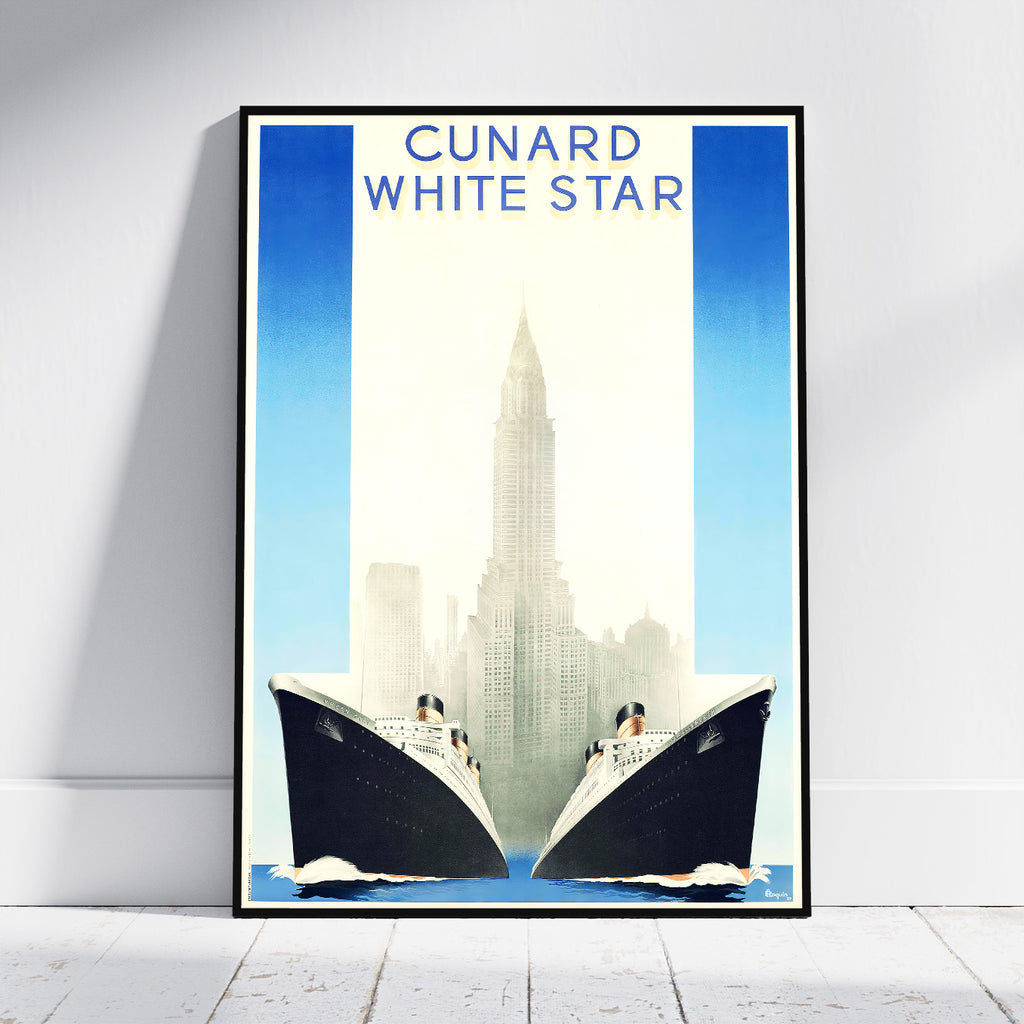 A framed vintage-style travel poster leaning against a white wall on a light wood floor. The poster reads 'CUNARD WHITE STAR' at the top and depicts two large ocean liners facing each other in front of a city skyline with a tall central tower.
