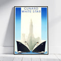 A framed vintage-style travel poster leaning against a white wall on a light wood floor. The poster reads 'CUNARD WHITE STAR' at the top and depicts two large ocean liners facing each other in front of a city skyline with a tall central tower.