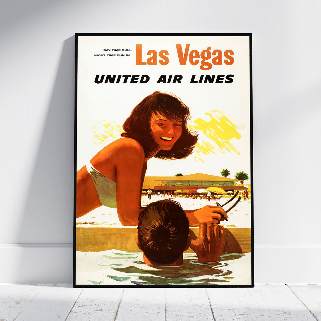 A framed vintage-style Las Vegas United Air Lines poster leaning against a white wall on a light floor. The poster shows a retro illustration of a woman by a pool with the text 'Las Vegas UNITED AIR LINES' at the top.