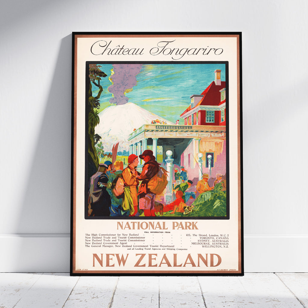 A framed vintage-style travel poster for Chateau Tongariro National Park in New Zealand, leaning against a white wall on a light floor. The poster features a colorful illustration of a building, people, trees, and a snowy mountain, with the text 'Chateau Tongariro', 'National Park', and 'New Zealand'.