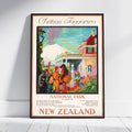 A framed vintage-style travel poster for Chateau Tongariro National Park in New Zealand, leaning against a white wall on a light floor. The poster features a colorful illustration of a building, people, trees, and a snowy mountain, with the text 'Chateau Tongariro', 'National Park', and 'New Zealand'.