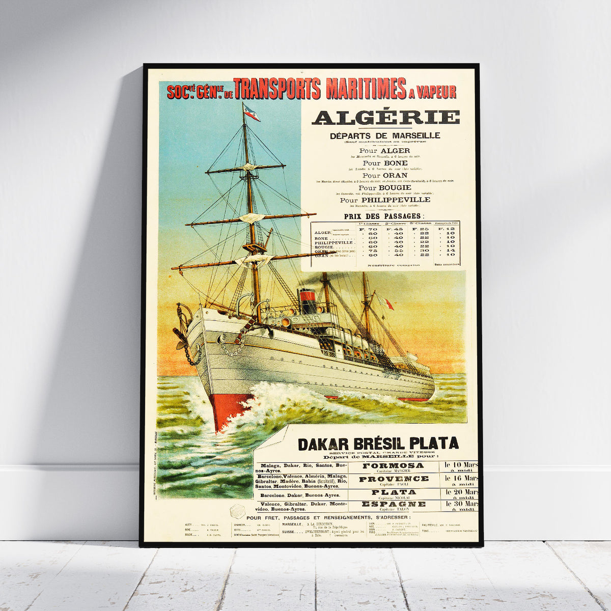 A framed vintage travel poster for Algérie maritime, featuring an illustration of a sailing ship on the sea with printed text and pricing information, leaning against a light gray wall on a white floor.