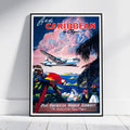 A framed vintage-style travel poster leaning against a white wall on a light floor. The poster reads 'Fly to the CARIBBEAN by Ocean' and 'Pan American World Airways' with an illustration of a retro airplane, palm trees, a red-and-yellow parrot, and people by the ocean.