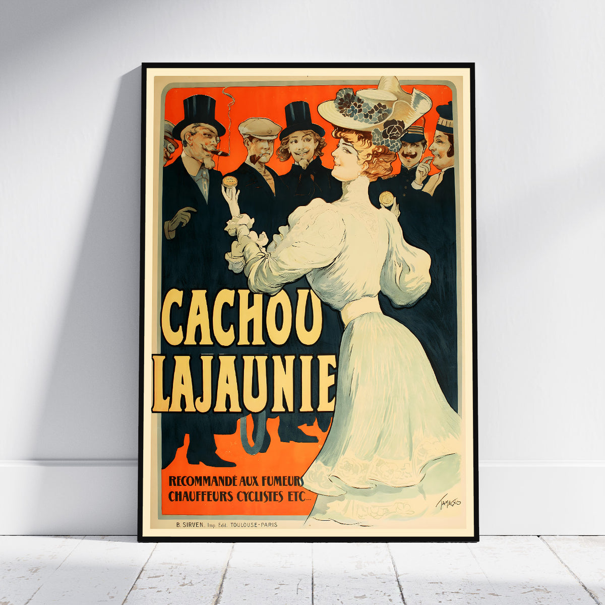 A framed vintage-style poster leaning against a white wall on a light floor. The poster shows an illustrated woman in a white dress and hat beside large yellow text reading 'CACHOU LAJAUNIE' on a red and cream background, with men in dark suits behind her.
