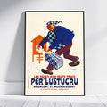 A framed vintage-style poster leaning against a white wall on a light floor. The poster shows an illustrated man in a blue and black checkered outfit carrying a box labeled 'PÉR LUSTUCRU'.