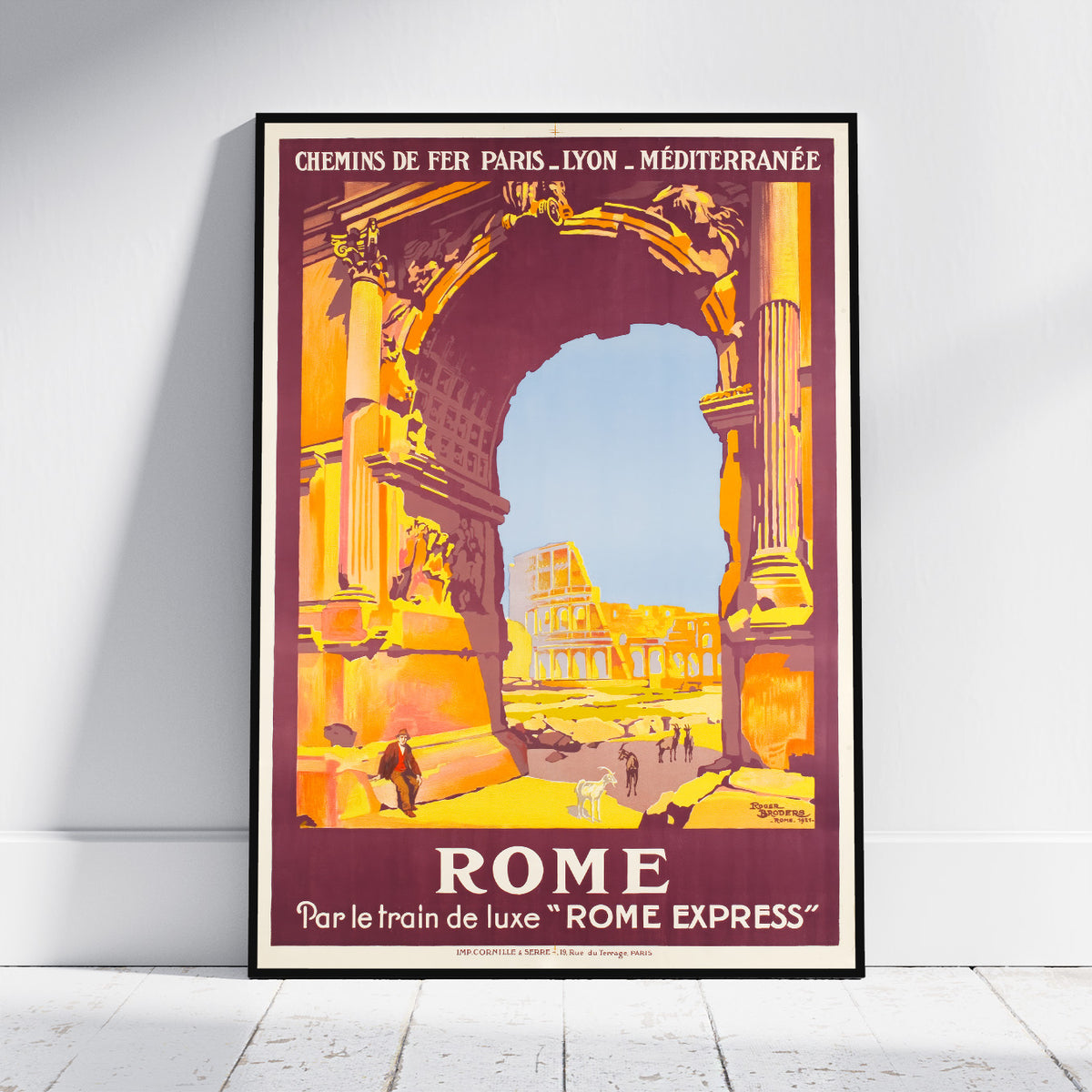 A framed vintage-style travel poster for Rome, leaning against a white wall on a light wood floor. The poster features a large stone archway in warm orange and yellow tones, with the Colosseum visible in the background under a pale blue sky.