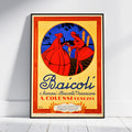 A framed vintage-style poster leaning against a white wall on a light floor. The poster features a cream background with a red ornamental border, a central blue oval containing two red figures, and large blue and red text reading "Baicoli" and "A.