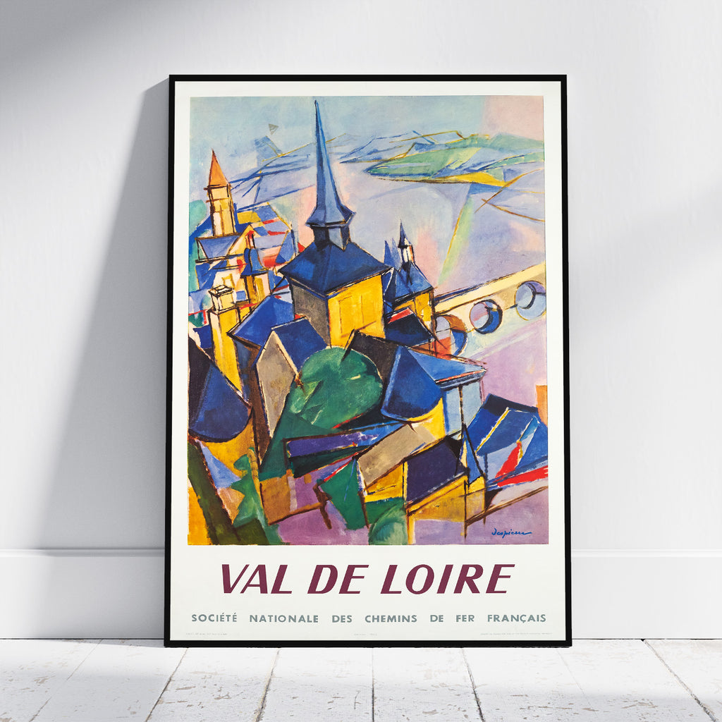 A framed vintage-style travel poster leaning against a white wall on a light wood floor. The poster depicts an abstract cityscape with spires and buildings in blue, yellow, green, and purple, with the text 'VAL DE LOIRE' and 'SOCIETE NATIONALE DES CHEMINS DE FER FRANCAIS' at the bottom.