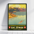 A framed vintage-style travel poster leaning against a white wall on a light floor. The poster depicts a scenic lake and mountain landscape with the text 'C· Générale de Navigation sur le Lac Leman' and Swiss flag motifs.
