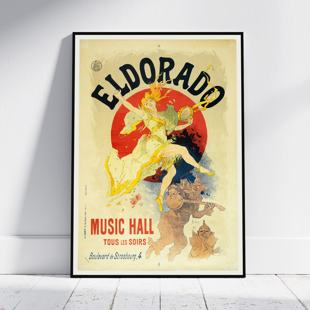 A framed vintage-style poster leaning against a white wall on a light wood floor. The poster features the text 'ELDORADO' and 'MUSIC HALL' with an illustrated woman in a flowing dress over a large red circle and smaller figures below.