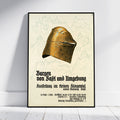 A framed vintage-style poster leaning against a white wall on a light wood floor. The poster features a large medieval-style bronze helmet illustration above German text, with faint castle sketches in the background.
