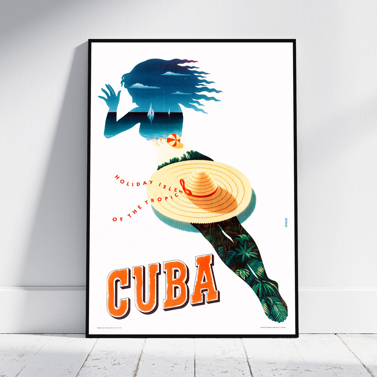 A framed travel poster of Cuba leaning against a white wall on a light wood floor. The poster features a stylized woman's silhouette filled with blue tropical waves and foliage, wearing a large yellow-orange sombrero, with the word 'CUBA' in bold orange letters at the bottom.