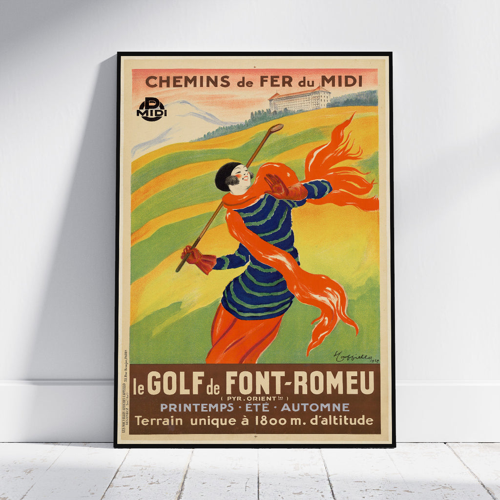 A framed vintage-style travel poster leaning against a white wall on a light floor. The poster reads 'CHEMINS de FER du MIDI' and 'le GOLF de FONT-ROMEAU' and depicts a person in a blue striped top and orange scarf running through green and yellow fields.