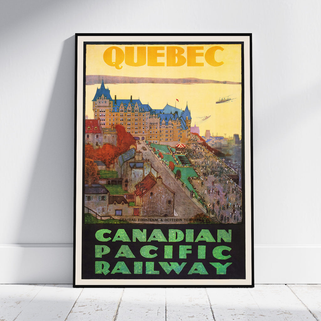 A framed vintage-style travel poster for Quebec and the Canadian Pacific Railway, leaning against a white wall on a light floor. The poster features a yellow sky, a large castle, colorful buildings, and green lettering at the bottom.