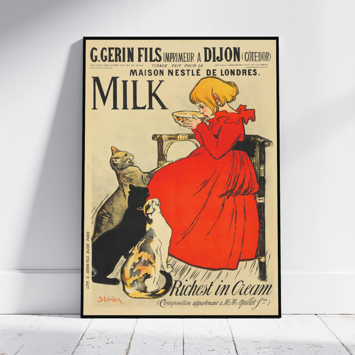 A framed vintage-style milk advertisement poster leaning against a white wall on a light wood floor. The poster features an illustration of a woman in a red dress sitting on a chair and reading a milk carton, with cats at her feet.