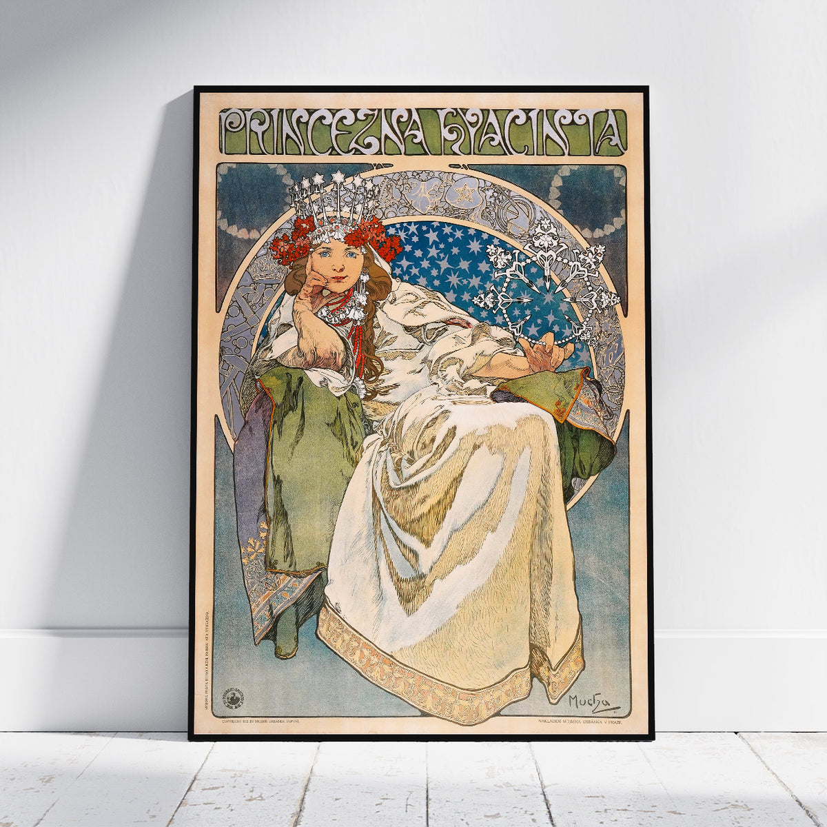 A framed Art Nouveau style poster leaning against a white wall on a light wood floor. The poster features an illustrated seated woman in a cream gown with red floral accents, blue circular background details, and the text 'PRINCESS PACIA' at the top.