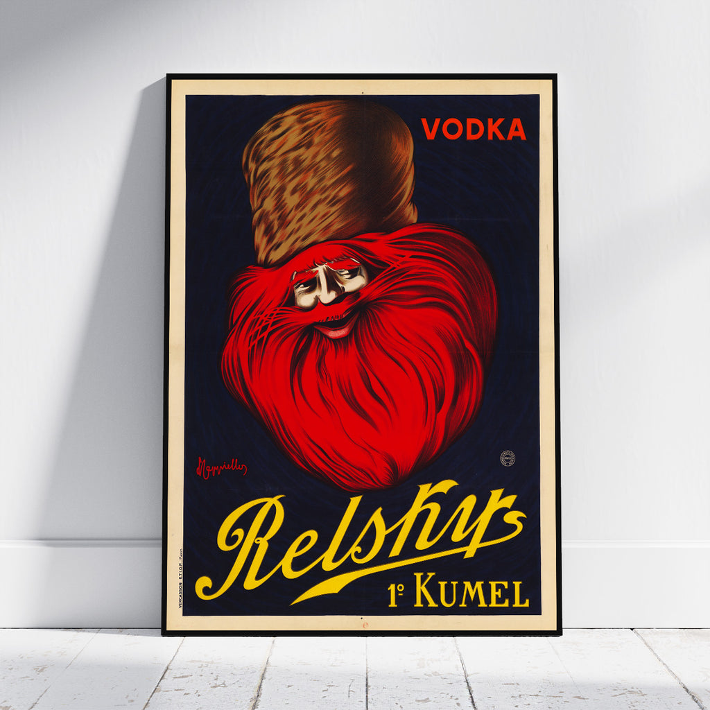 A vintage-style poster print leaning against a white wall on a light floor. The artwork shows a red-and-black illustrated face with a brown hat, the word 'VODKA' in red at the top right, and large yellow script reading 'Relsky 1st Kumel' at the bottom.