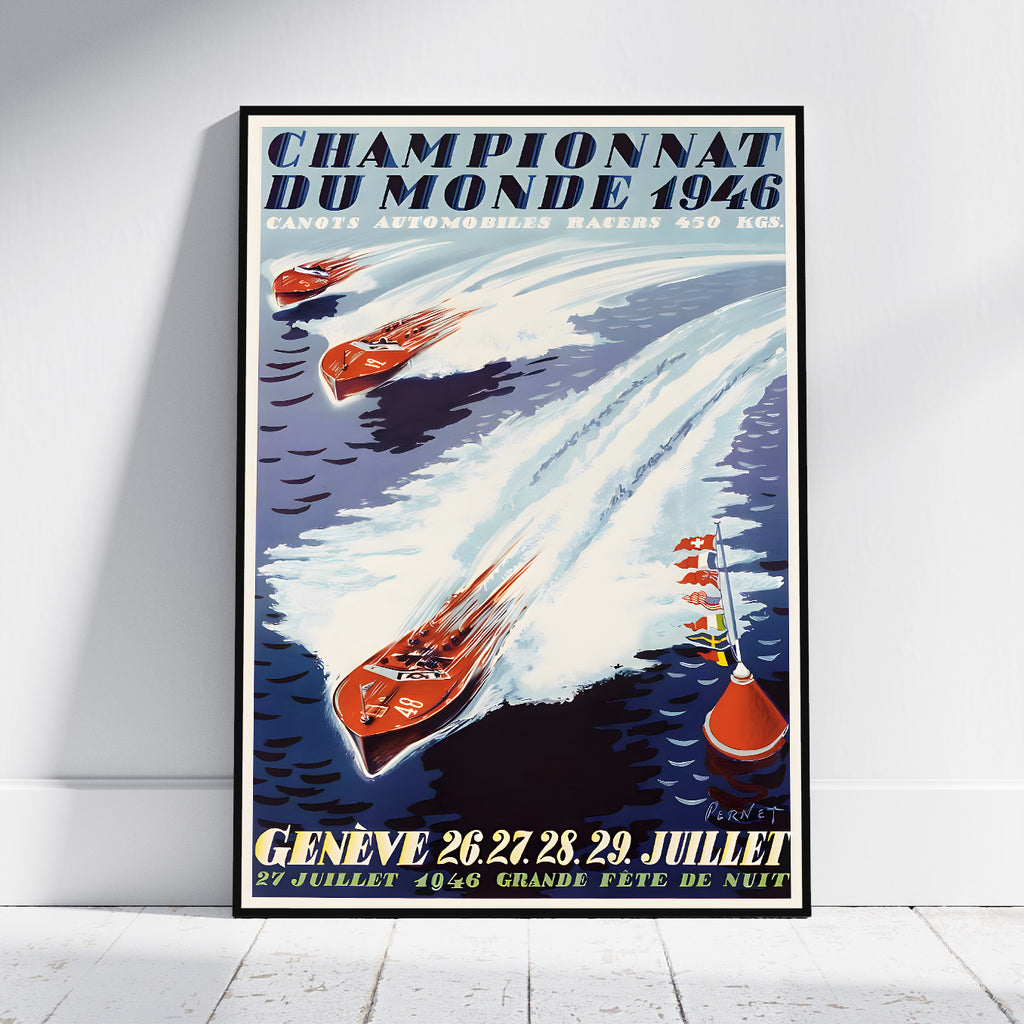 A framed vintage racing poster leaning against a white wall on a light floor. The poster reads “Championnat du Monde 1946” and shows several red boats racing on dark blue water with white wakes, plus yellow text at the bottom reading “Genève 26 27 28, 29 Juillet 27 Juillet 4046 Grande Fête de Nuit.