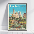 A framed vintage-style New York City poster leaning against a white wall on a light floor. The poster shows the words 'New York' at the top and 'UNITED AIR LINES' at the bottom, with a retro illustration of skyscrapers, trees, a stone bridge, a river, and an airplane in the sky.