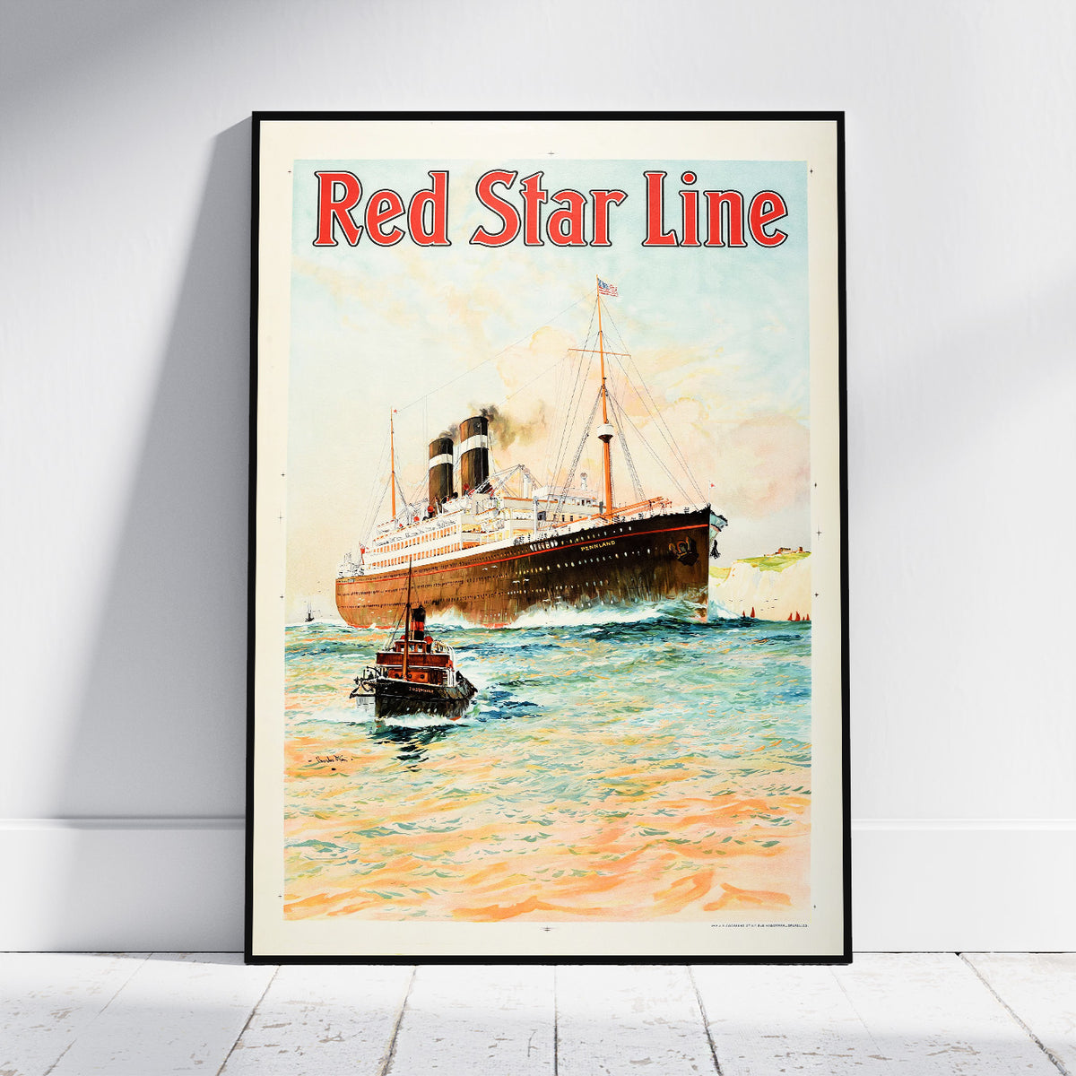 A framed vintage-style travel poster leaning against a white wall on a light floor. The poster shows a large ocean liner with the text 'Red Star Line' at the top and a small tugboat in the foreground over blue-green water with warm orange highlights.