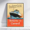 A framed vintage-style travel poster leaning against a white wall on a light wood floor. The poster shows a large ocean liner rising from the sea, with the text 'The Liverpool route to U.