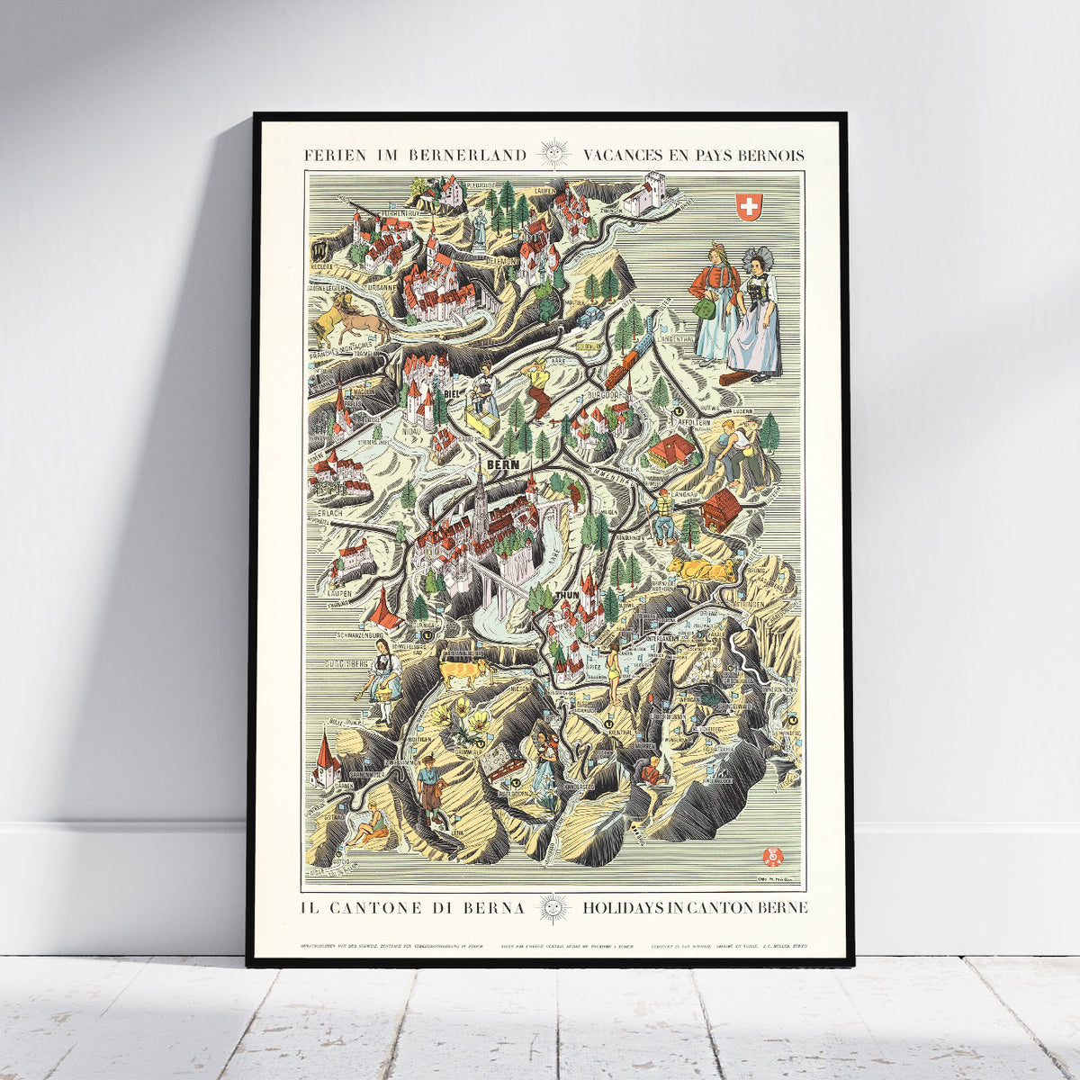 A framed vintage-style travel map poster of Bern, Switzerland, leaning against a white wall on a light wood floor. The poster features a detailed illustrated itinerary with small figures, mountains, and buildings in muted earth tones, cream paper, and black text.