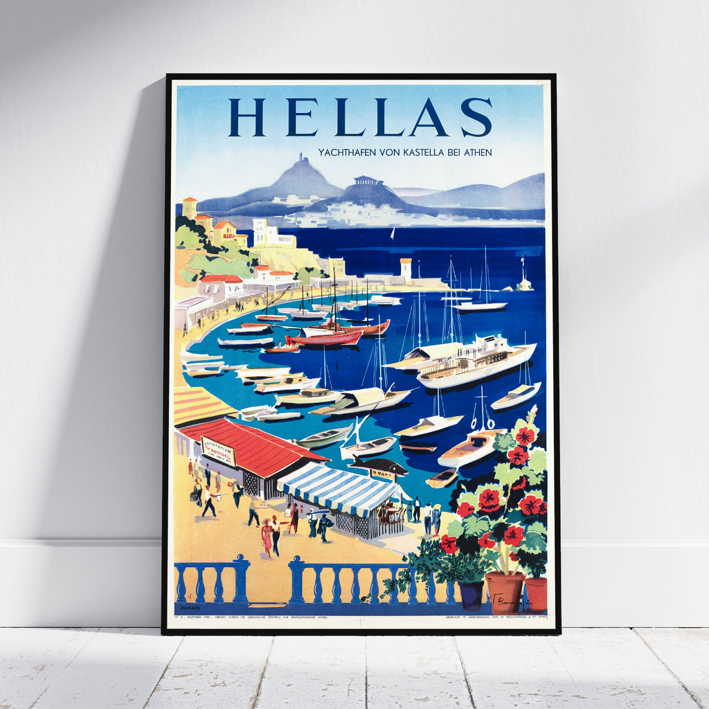 A framed vintage-style travel poster leaning against a white wall on a light wood floor. The poster features the word 'HELLAS' at the top and an illustrated harbor scene with boats, buildings, mountains, and flowers.