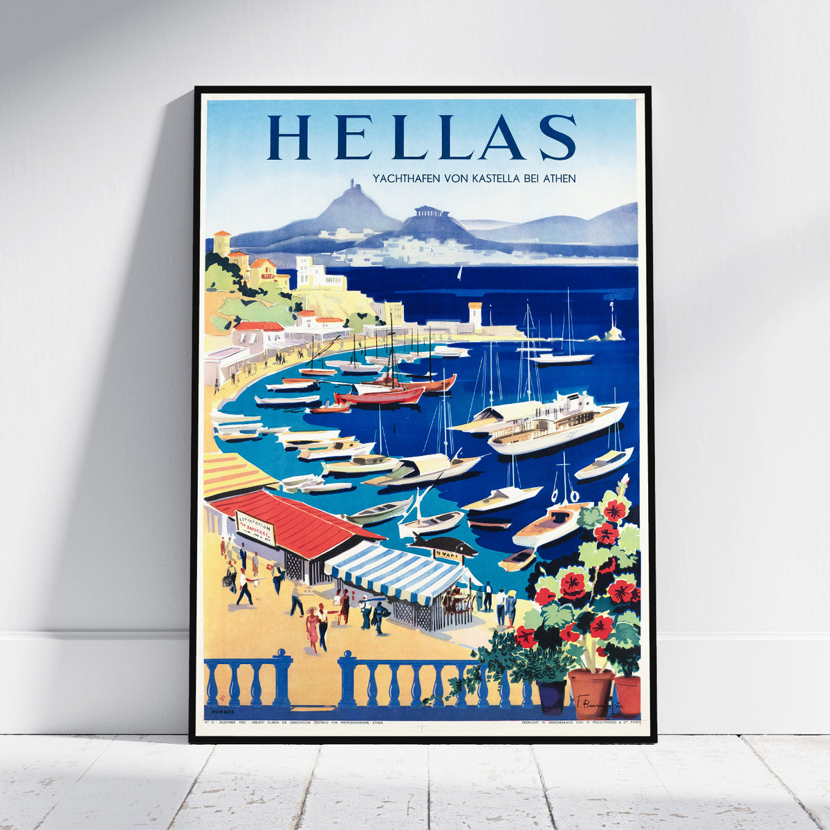 A framed vintage-style travel poster leaning against a white wall on a light wood floor. The poster features the word 'HELLAS' at the top and an illustrated harbor scene with boats, buildings, mountains, and flowers.