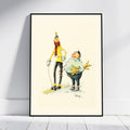 A framed art print featuring a whimsical illustration of a person skiing and another person carrying skis, displayed against a light gray wall on a white wooden floor.