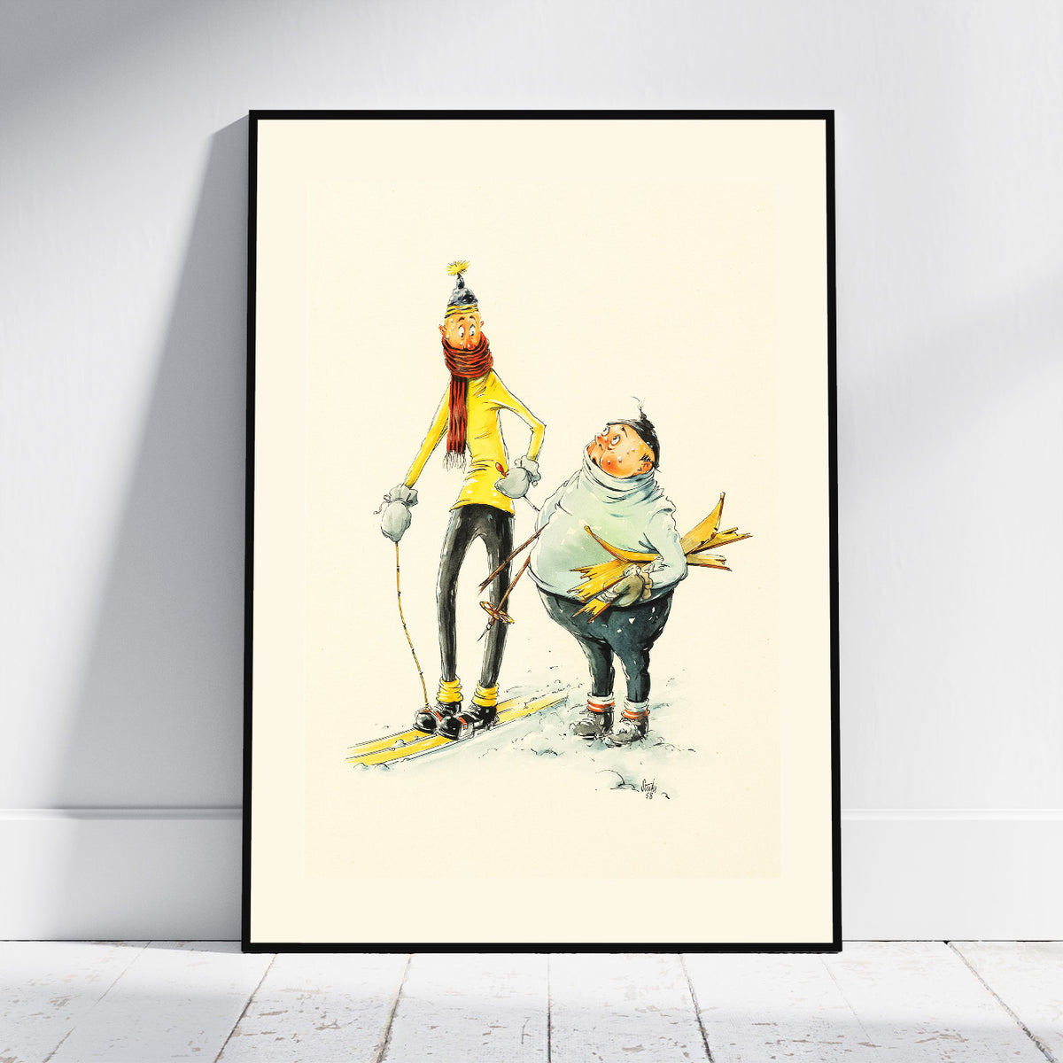 A framed art print featuring a whimsical illustration of a person skiing and another person carrying skis, displayed against a light gray wall on a white wooden floor.