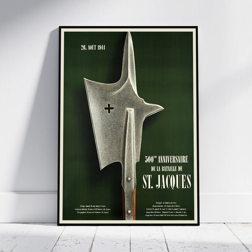 A framed vintage military poster leaning against a white wall on a light wood floor. The poster features a large silver battle axe on a dark green background with white text reading '26.