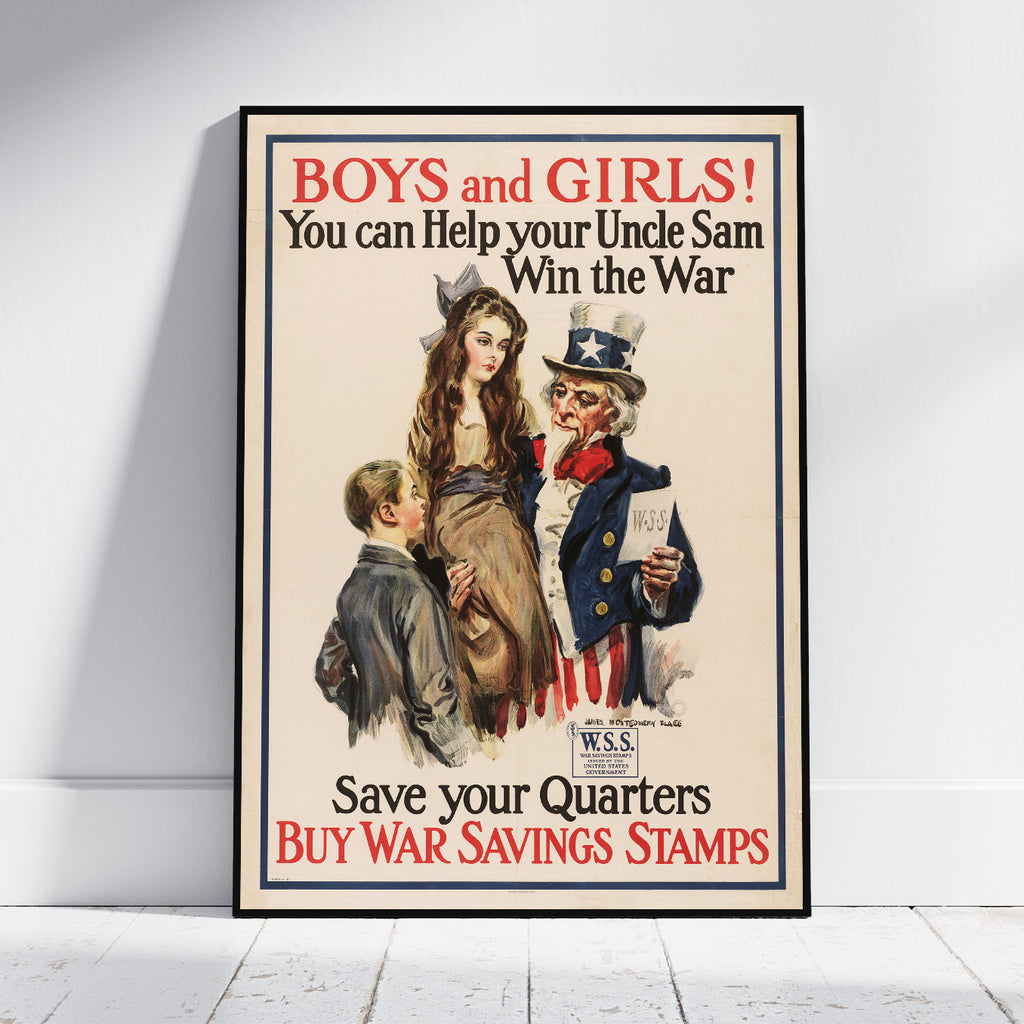 A framed vintage-style poster leaning against a white wall on a light floor. The poster reads “BOYS and GIRLS! You can Help your Uncle Sam Win the War Save your Quarters BUY WAR SAVINGS STAMPS” and shows an illustrated Uncle Sam, a woman, and a boy.
