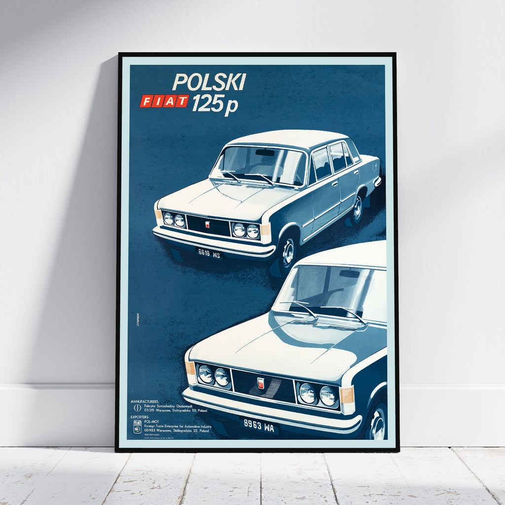 A framed vintage-style poster leaning against a white wall on a light floor. The poster shows two illustrations of a white and blue Fiat 125p car with the text 'POLSKI FIAT 125p' at the top.