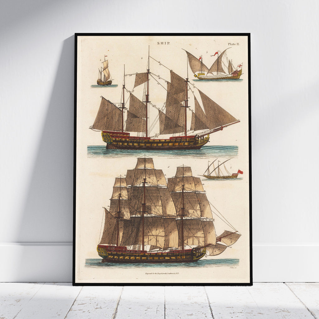 A framed vintage nautical art print featuring detailed illustrations of historical sailing ships on an off-white background, leaning against a white wall on a light wood floor.