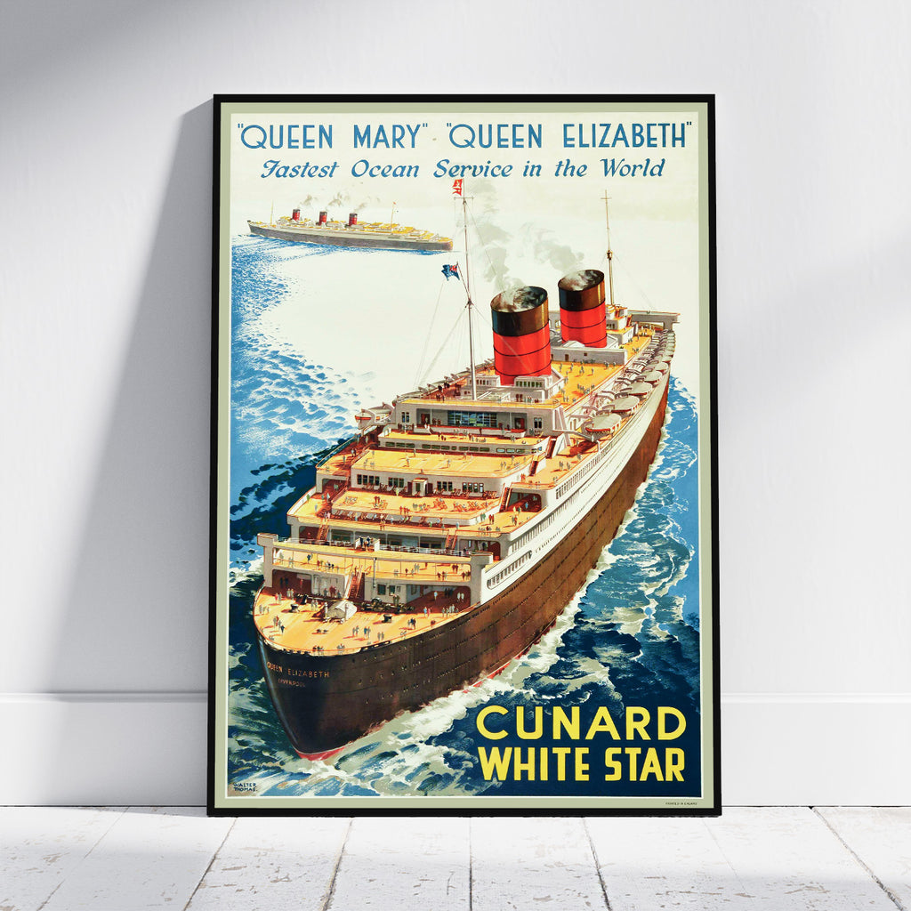 A framed vintage Cunard White Star ocean liner poster leaning against a white wall on a light floor. The poster features an illustration of the Queen Mary and Queen Elizabeth class ship Cunard White Star at sea, with blue water, cream sky, red and black smokestacks, and yellow text reading 'CUNARD WHITE STAR'.