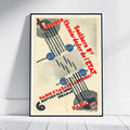 A framed vintage travel poster for Southern Railway from Paris to London, leaning against a white wall on a light wood floor. The poster features a cream background with bold red typography, black graphic lines, and blue circular accents.