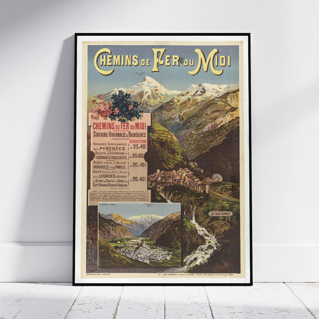 A framed vintage travel poster for 'Chemin de Fer du Midi' leaning against a white wall on a light wood floor. The poster features a scenic mountain landscape with a train station, a waterfall, and a train station in Grenoble, with French text and an illustrated landscape.