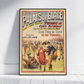 A framed vintage French ice skating poster leaning against a white wall on a light wood floor. The poster features colorful illustrations of people skating and bold text reading 'PALAIS DE GLACE' and 'PATINAGE SUR GLACE NATURELLE'.