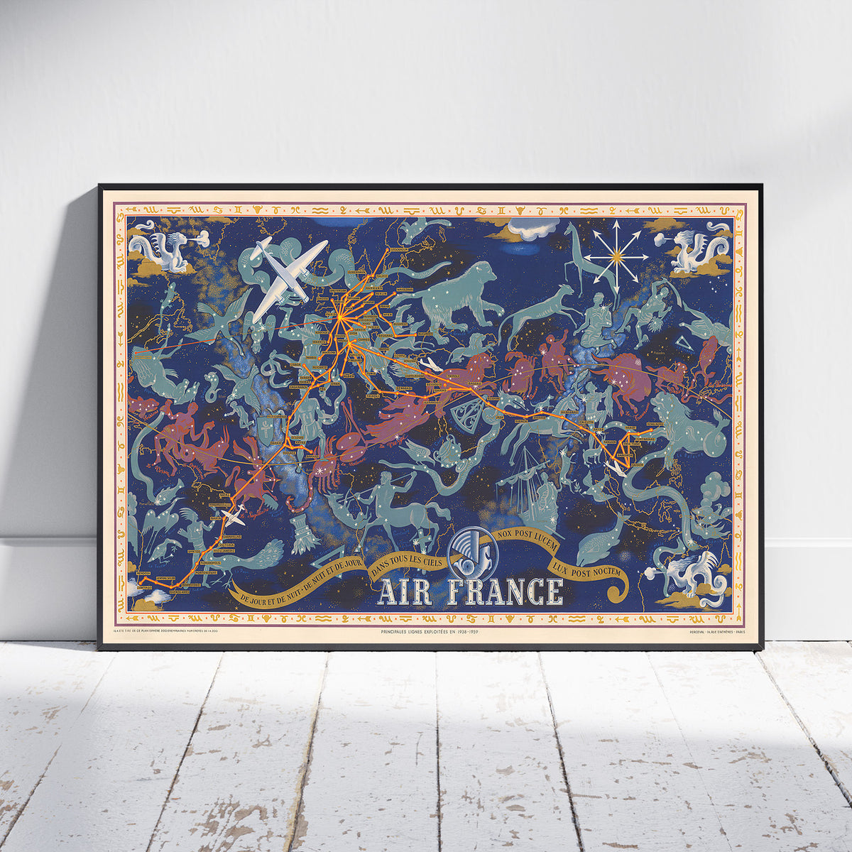 A framed vintage-style poster titled 'AIR FRANCE' leaning against a white wall on a white wooden floor. The poster features a dark blue background with illustrated airplanes, birds, stars, and ornate gold and teal decorative elements.